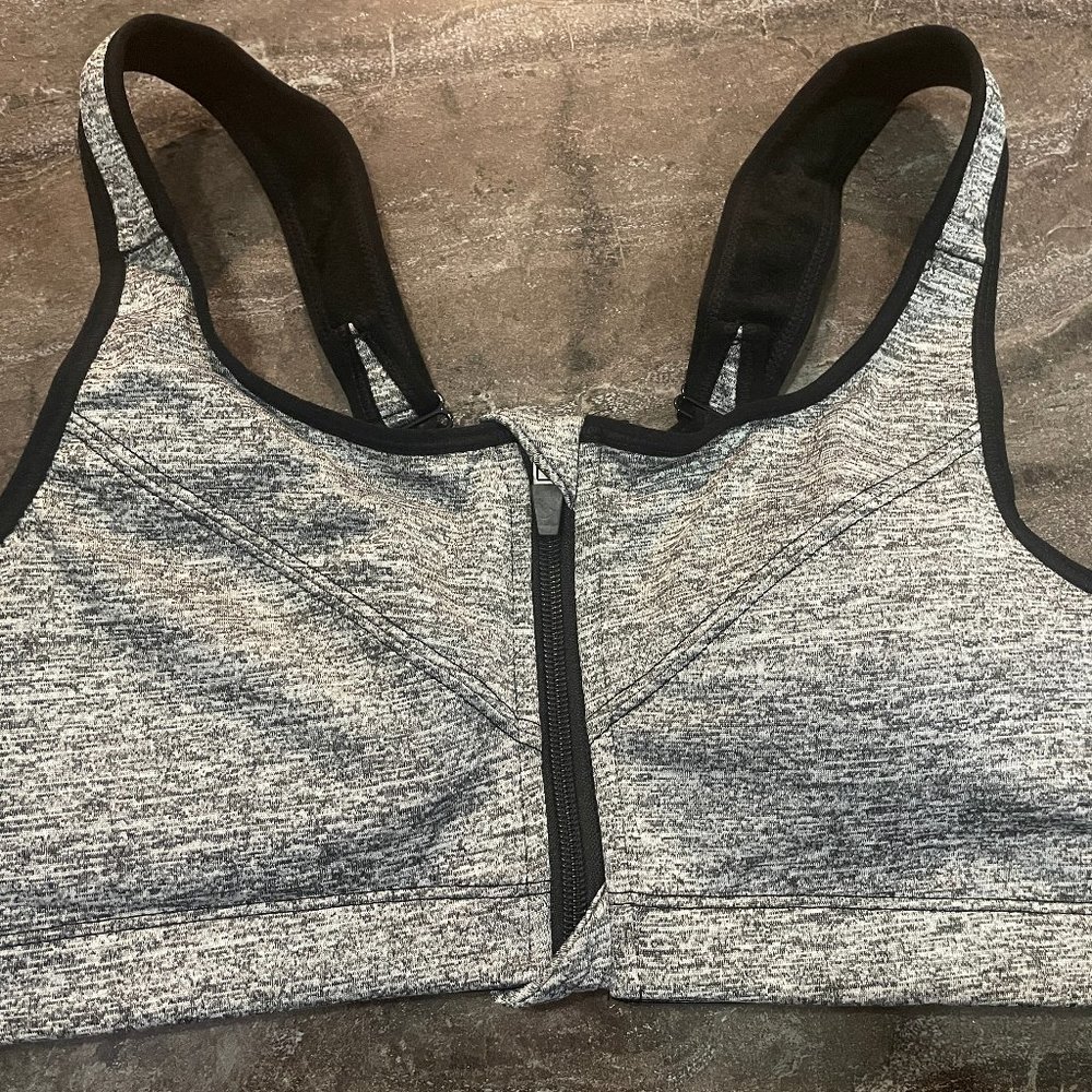 Sports bra with zippered front closet with hook and eye back closer brand new